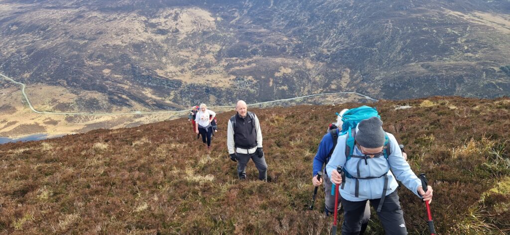 May be an image of 4 people and mountain