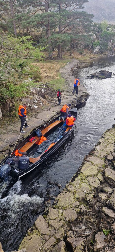 May be an image of 4 people, kayak, fog and body of water