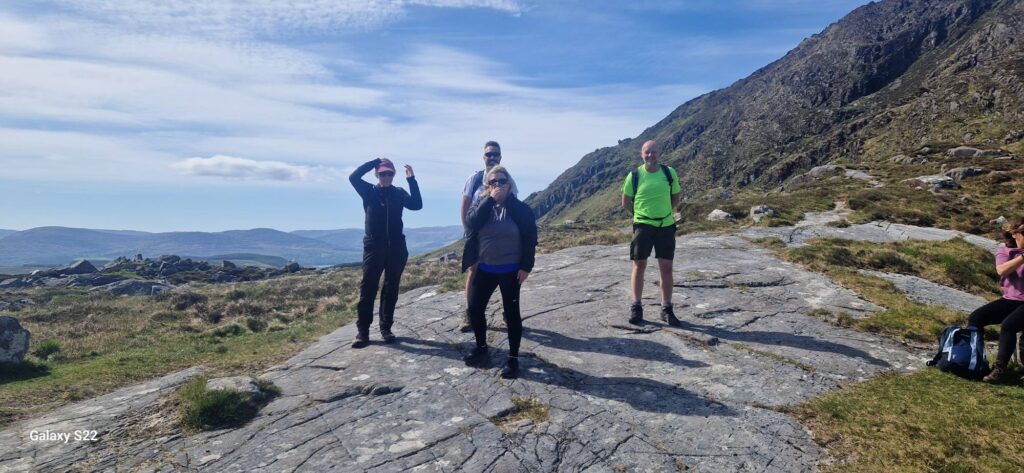 May be an image of 4 people, fog and mountain